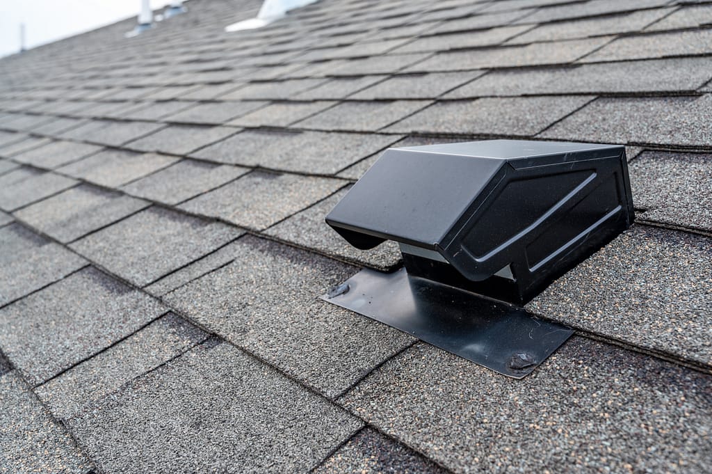 Static vent installed on a shingle roof for passive attic ventilation typical static passive vent installation on a residential roof