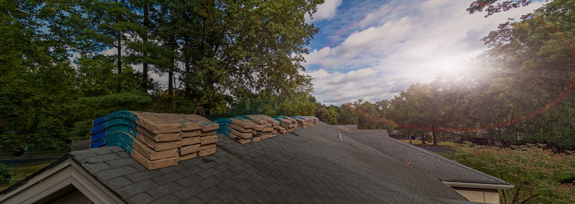 Shingle Bundles Stacked on Roof to Repair Storm Weather Damage