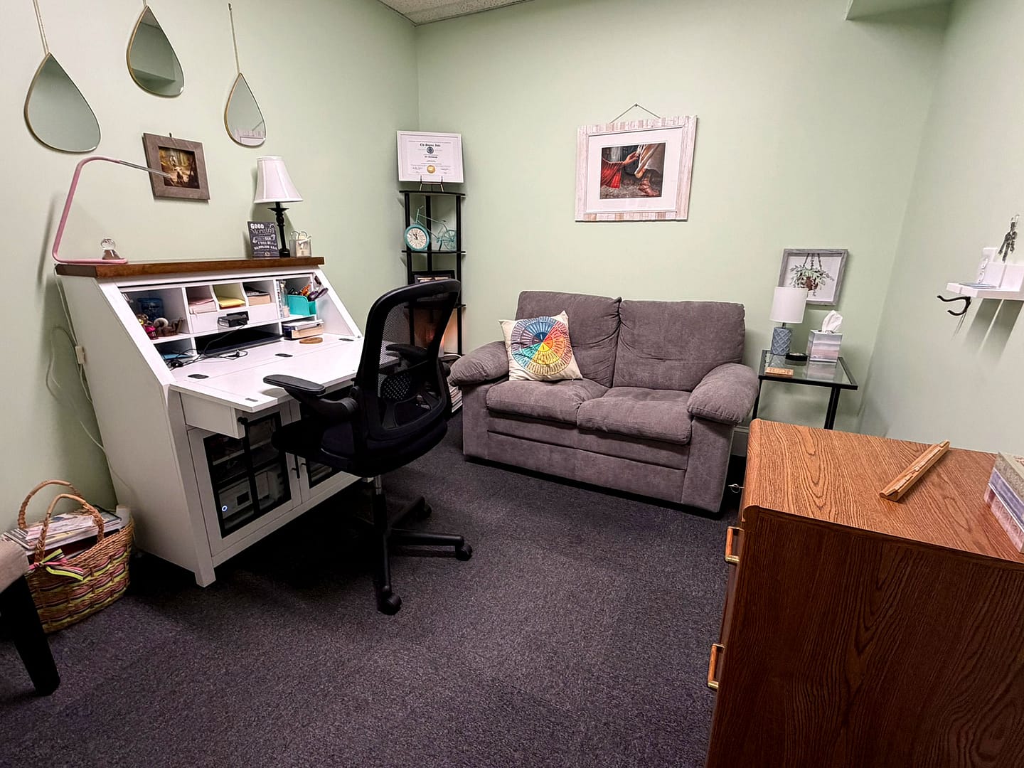 Robintek Rentals office 100 with a small desk and couch