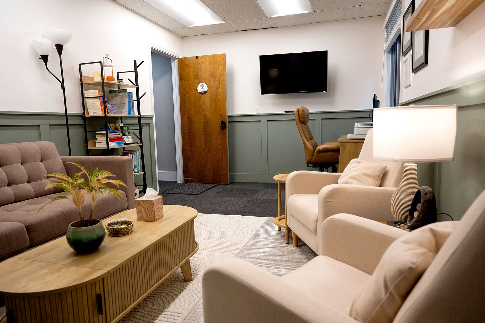 Robintek Rentals office 104 showing seating area and desk
