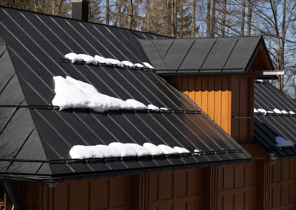 snow on metal roof