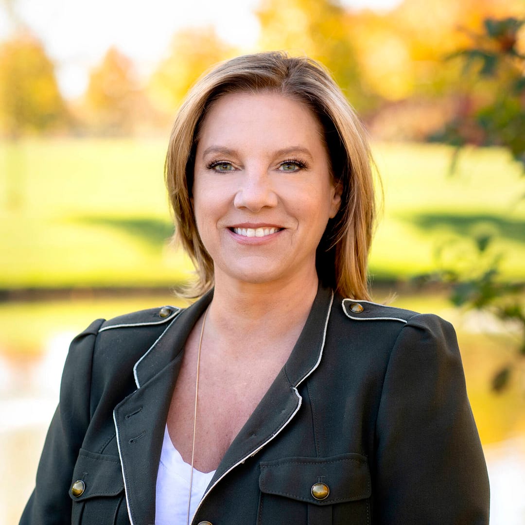 smiling business woman with fall park background