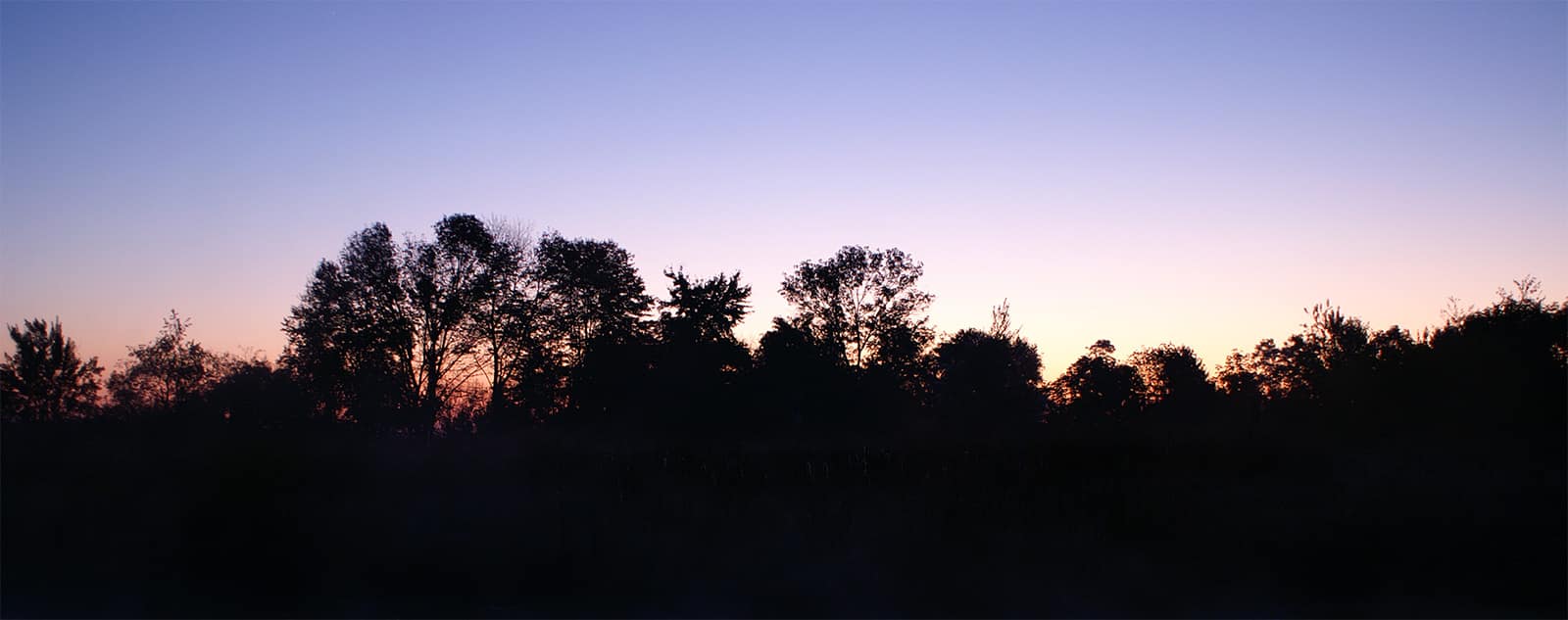 Sun rises over the fishing pond at Chestnut Ridge.