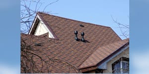 A picture of a roofline, with the reminder to Keep Your Roof in Shape with a Routine Roof Maintenance Plan