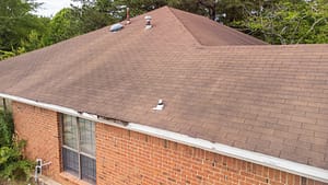 image of a home with dark spots on a roof