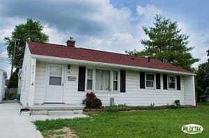 a house with red shingles, a shingle color that matches nicely for curb appeal