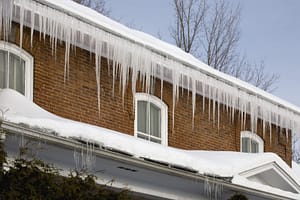 Frozen gutters causing roof damage