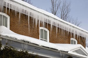 Icicles Hanging Off Rain Gutters showing there are ice dams in the gutters