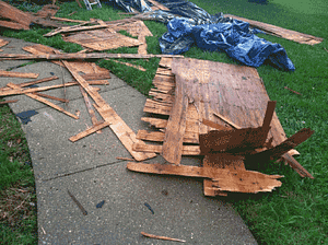 a view of rotting OSB removed from a roof during a roof replacement