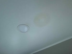 A picture of a celing with ceiling water stains.