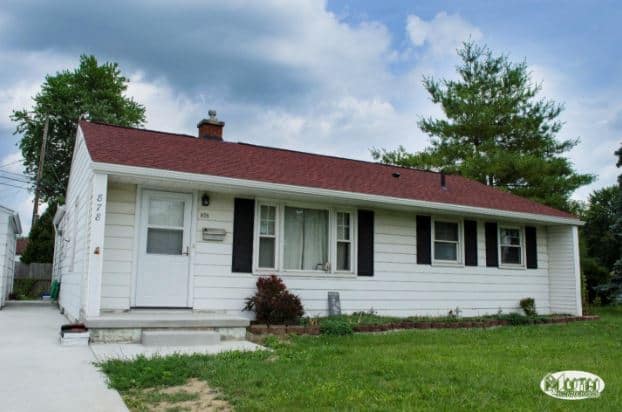 a house with red shingles, a shingle color that matches nicely for curb appeal