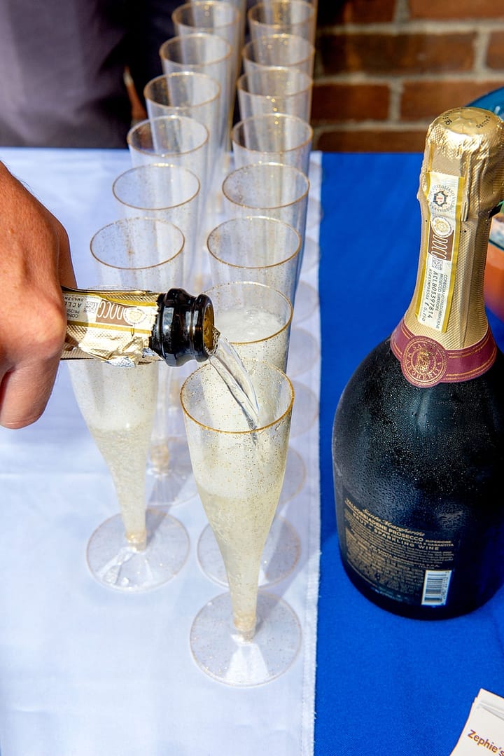 Champagne being poured at the Robintek Open House and 25th Anniversary Celebration