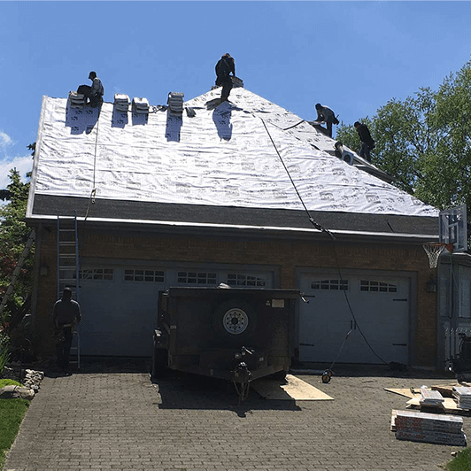 Muth roofers working on a new roof
