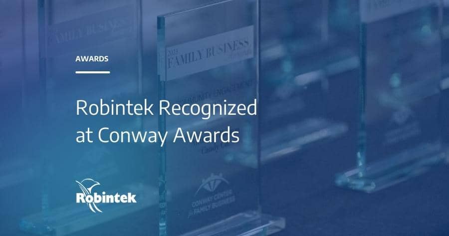 Glass awards for the 2023 Conway Family Business Awards with the text "Robintek Recognized at Conway Awards"