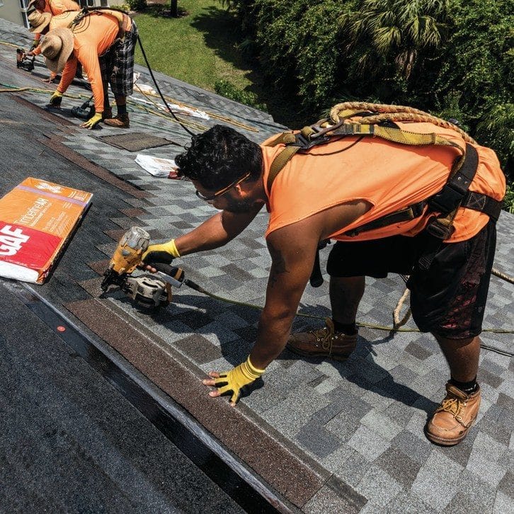 GAF Timberline American Harvest shingles being installed on roof installation